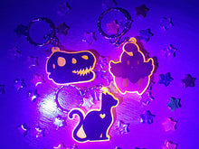 Load image into Gallery viewer, Dinosaur / TRex Head Skeleton 2in Orange UV Acrylic Charm
