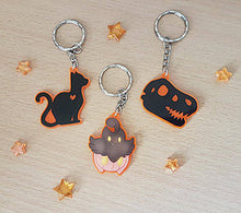 Load image into Gallery viewer, Dinosaur / TRex Head Skeleton 2in Orange UV Acrylic Charm
