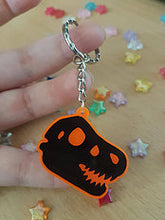 Load image into Gallery viewer, Dinosaur / TRex Head Skeleton 2in Orange UV Acrylic Charm
